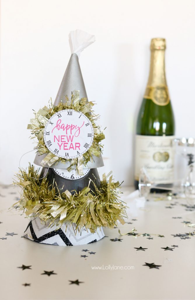 Paint or wrap fabric around dollar store party hats for EASY and cheap glam New Years Eve party gear! Cute!