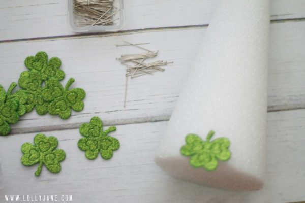 So easy to make a St Patricks shamrock tree, just pin felt stickers to styrofoam trees! #stpatricksdaycraft #shamrockcraft