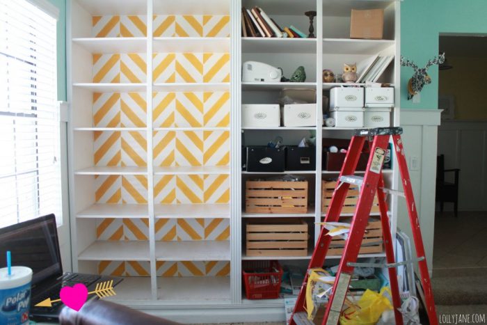 painting-a-herringbone-bookcase-stencil-during-picture
