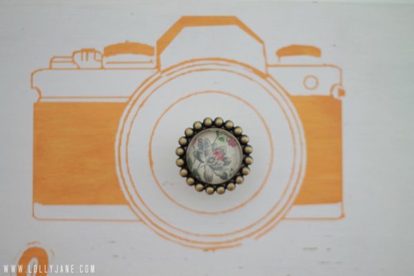 Hand painted camera with a cute knob makes a great camera bag holder #organization #lollyjane