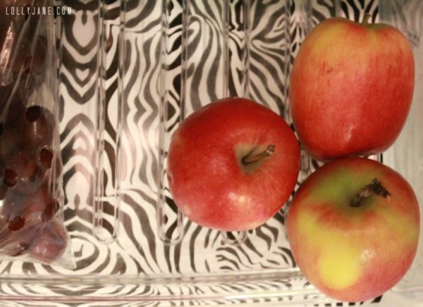 Line your shelves with contact paper and use baskets to keep your fridge organizaed! #kitchencleaningtips #organization