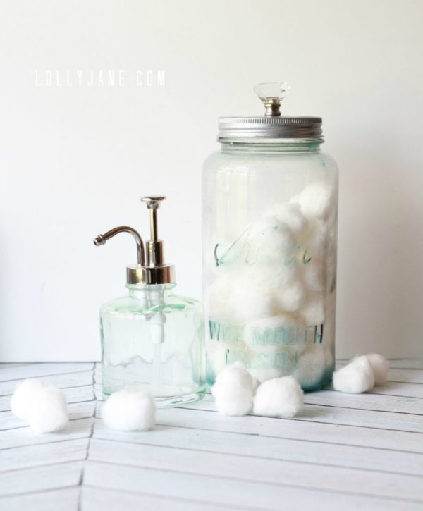 recycled food jars turned storage jars with glass knob tops