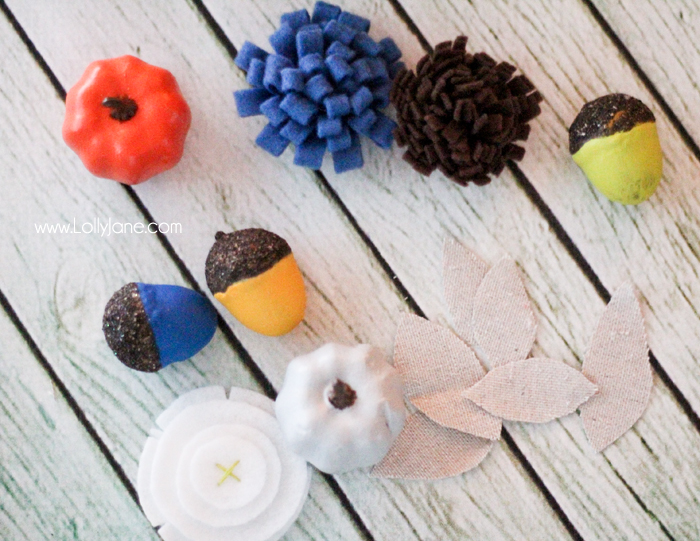 DIY Fall wreath tutorial. Love these felt flowers and painted pumpkins to create this pretty fabric fall wreath!