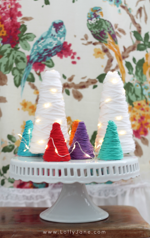 Yarn wrapped trees! Great for party decor, would be a fun centerpiece! Love the different colors and the wrapped lights! (lollyjane.com)