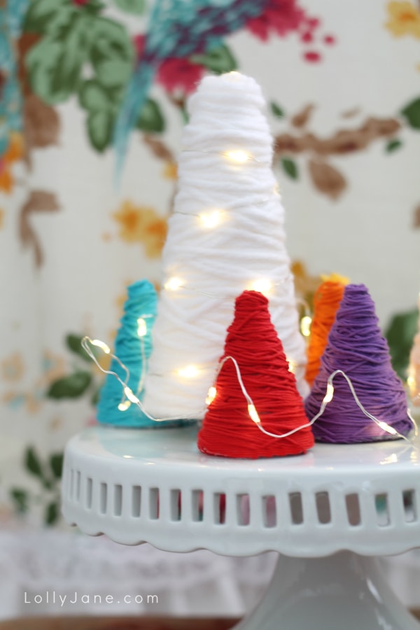 Yarn wrapped trees! Great for party decor, would be a fun centerpiece! Love the different colors and the wrapped lights! (lollyjane.com)