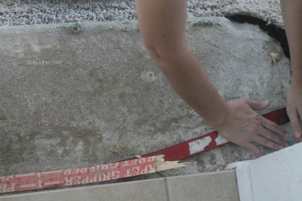 How to rip out carpet: use a crowbar to lift carpet tacks, pry from the middle.