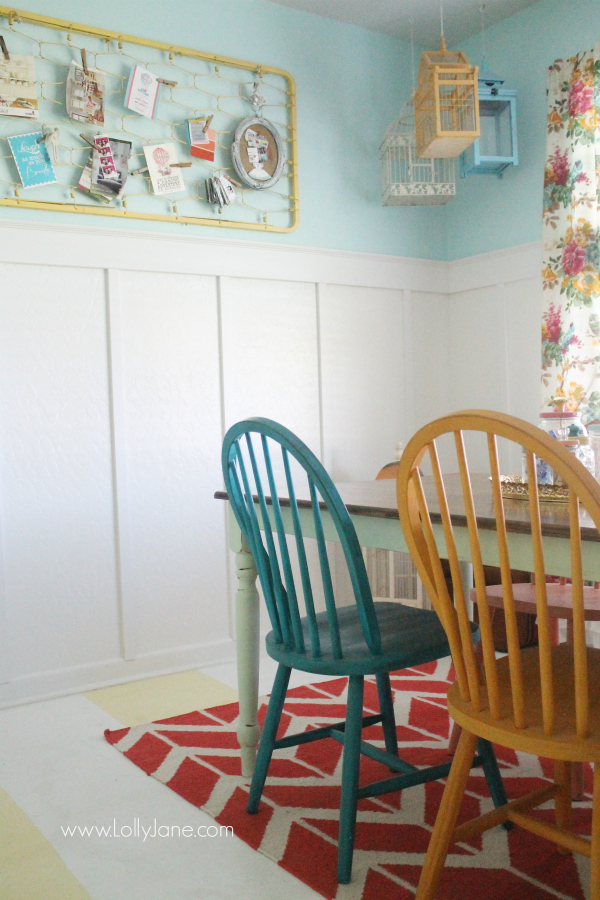 Use an old painted crib spring for easy wall decor in a colorful craft room! @lollyjaneblog