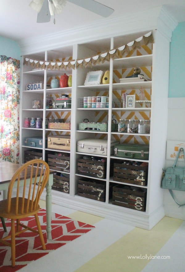 Lolly Jane's fun herringbone bookcase in their craft room! Love this space! @lollyjaneblog