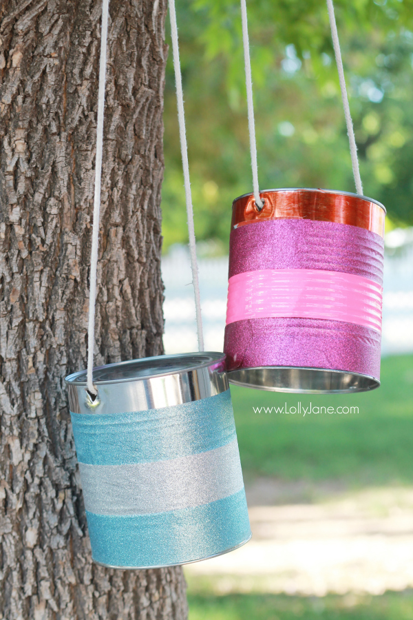 Make a set of DIY tin can stilts, an easy to make kids craft with cans and rope. keep kids active and busy all day long! #kidsactivity #kidscraft #boredombuster #howtomaketincanstilts #howtomakestilts #recycledcanideas