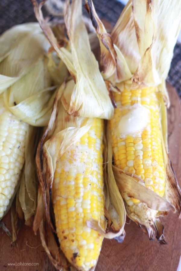 Perfectly grilled corn on the cob. Learn how to grill it with the husks on! via lollyjane.com