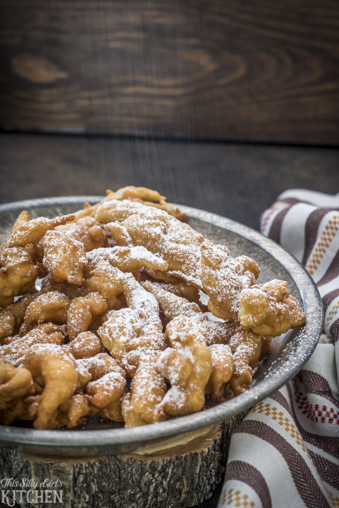 Basic funnel cake mix is spiced with cinnamon and pumpkin pie spice. Finely diced apples, powdered sugar and caramel sauce makes this a unique fall dessert! Can't wait to dig into this caramel apple funnel cake recipe, yum! #funnelcake #howtomakefunnelcake #caramelapplefunnelcake #fallrecipe #applerecipe