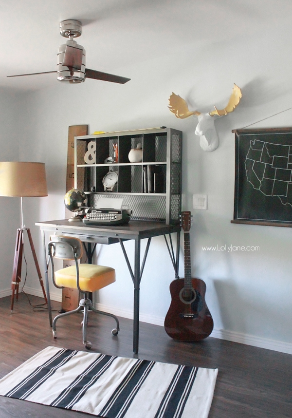 Industrial man cave home office. Love the modern ceiling fan and that desk! Awesome space! 