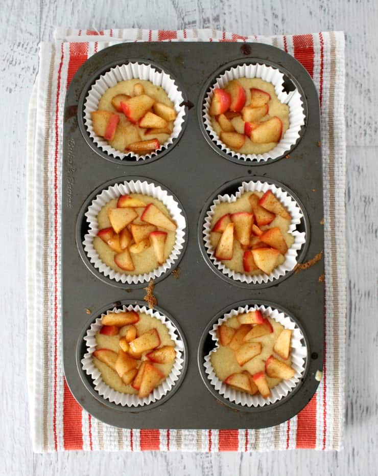 Holy YUM!! The mother of all fall desserts! These Vanilla Bean Apple Muffins look so amazing with their apples and cinnamon, mm! #appledessert #falldessert #fallrecipe #appledessert #vanillabean #vanillabeandessert