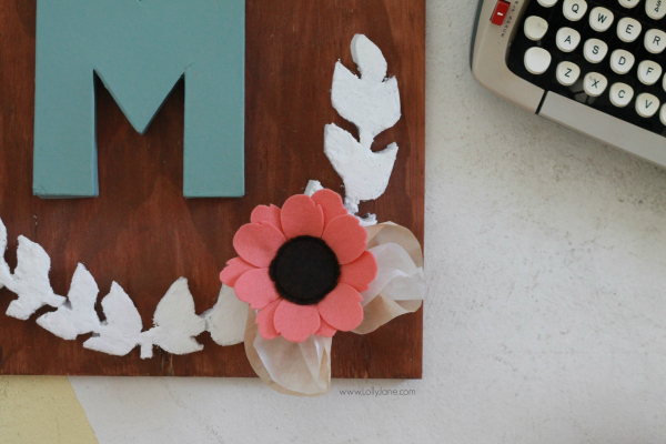 DIY project |Make this pretty monogram sign out of a surprise material: foam! Cute home decor that's easy to make!  So cute with mixed media felt flowers and coffee filter leaves. A great how-to on lollyjane.com