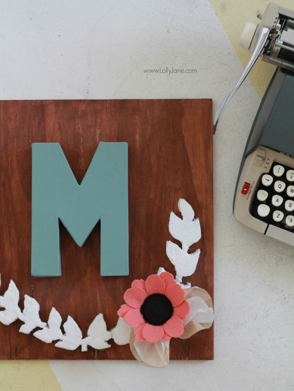 DIY project |Make this pretty monogram sign out of a surprise material: foam! Cute home decor that's easy to make!  So cute with mixed media felt flowers and coffee filter leaves. A great how-to on lollyjane.com