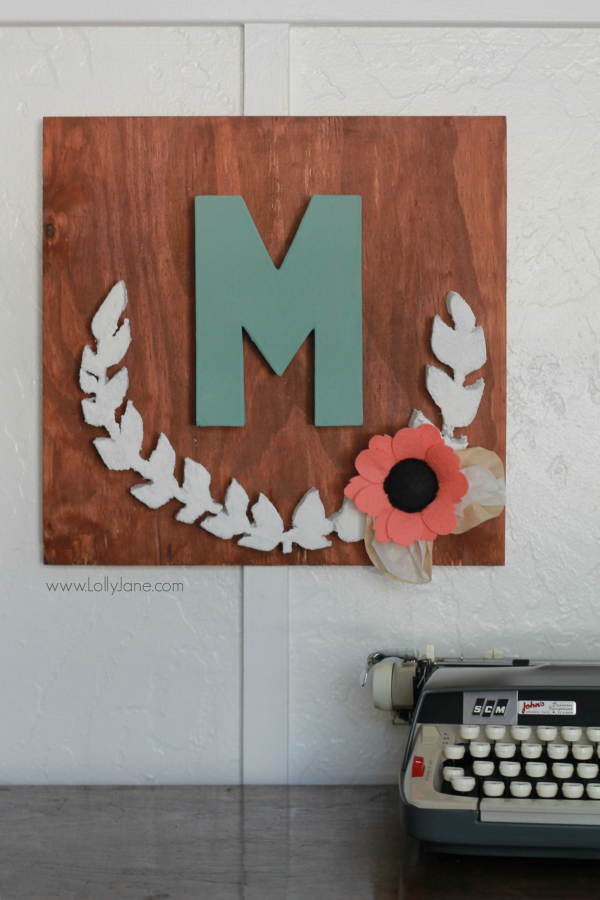 DIY project |Make this pretty monogram sign out of a surprise material: foam! Cute home decor that's easy to make!  So cute with mixed media felt flowers and coffee filter leaves. A great how-to on lollyjane.com