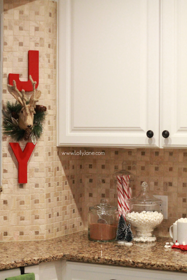 DIY | Adorable JOY Christmas wall decor. Cute way to dress up your kitchen. Click through for cute Christmas kitchen decor ideas.