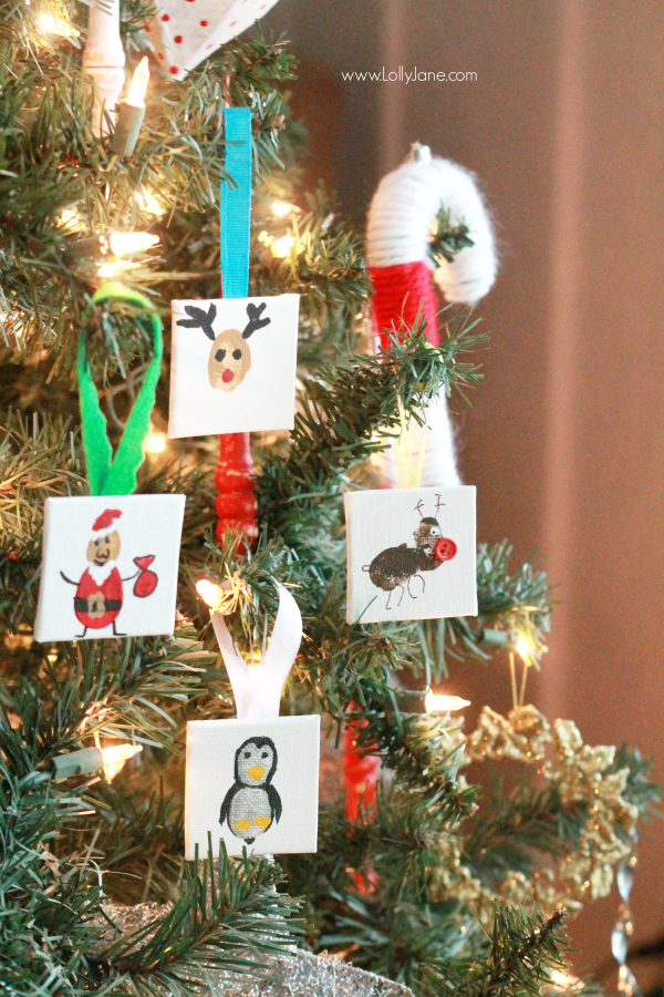 ADORABLE mini canvas thumbprint ornaments! SO EASY to make, kids have fun crafting and you get a Christmas keepsake for years to come. Great Christmas kids craft and Christmas gift idea!