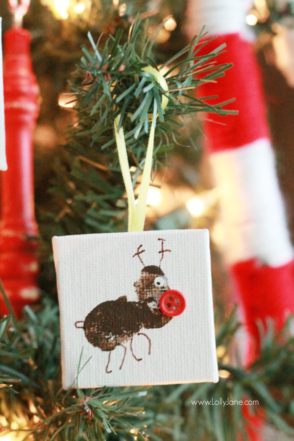 ADORABLE mini canvas thumbprint ornaments! SO EASY to make, kids have fun crafting and you get a Christmas keepsake for years to come. Great Christmas kids craft and Christmas gift idea! Love this Rudolph thumbprint ornament!