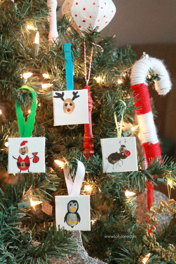 ADORABLE mini canvas thumbprint ornaments! SO EASY to make, kids have fun crafting and you get a Christmas keepsake for years to come. Great Christmas kids craft and Christmas gift idea!