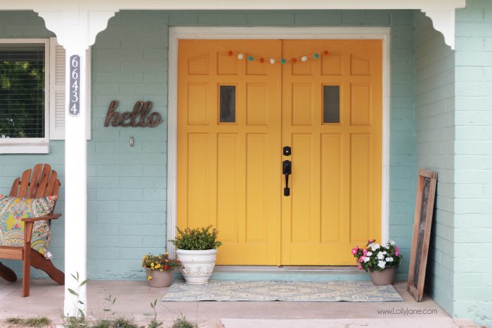 Freshly painted blue house with a mustard yellow door, before and after! Fun house color scheme reveal!