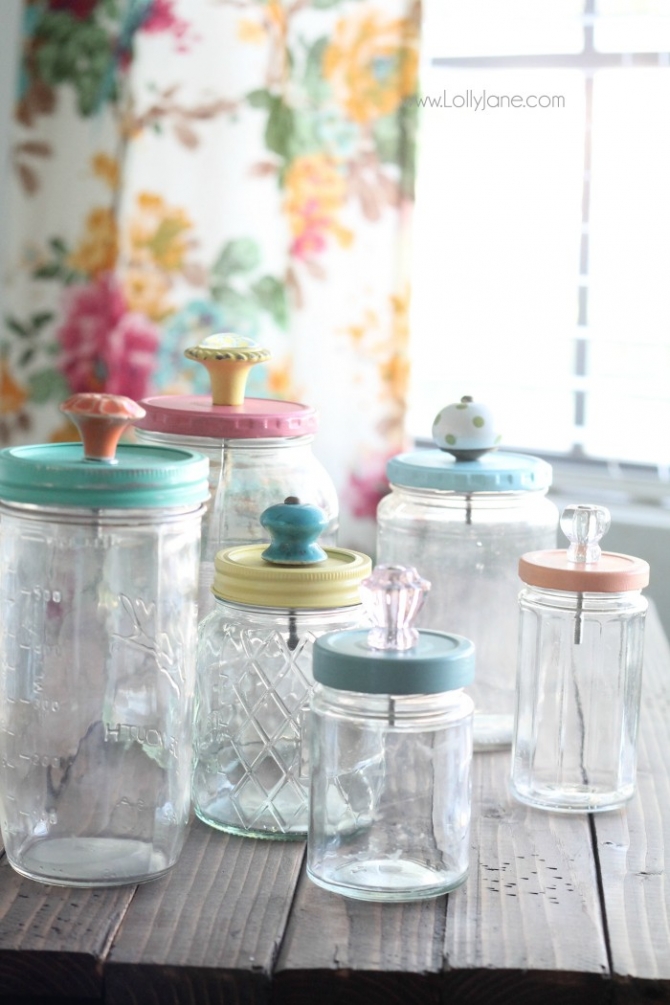 Add pretty knobs to the tops of mason jars for pretty mason jar storage solutions! Lots of options with this easy mason jar trick! Love these recycled food jars turned pretty storage jars with glass knob tops!