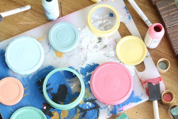 https://lollyjane.com/wp-content/uploads/2015/06/15-10878-post/paint-recycled-jar-lids-to-make-pretty-storage-jars-700x467.jpg