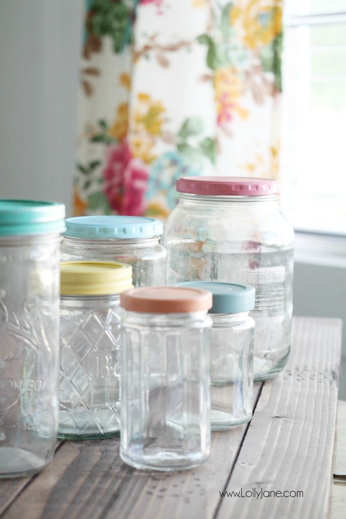 Add pretty knobs to the tops of mason jars for pretty mason jar storage solutions! Lots of options with this easy mason jar trick! Love these recycled food jars turned pretty storage jars with glass knobs!