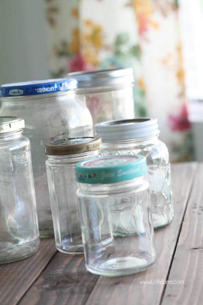 Add pretty knobs to the tops of mason jars for pretty mason jar storage solutions! Lots of options with this easy mason jar trick! Love these recycled food jars turned pretty storage jars with glass knobs!