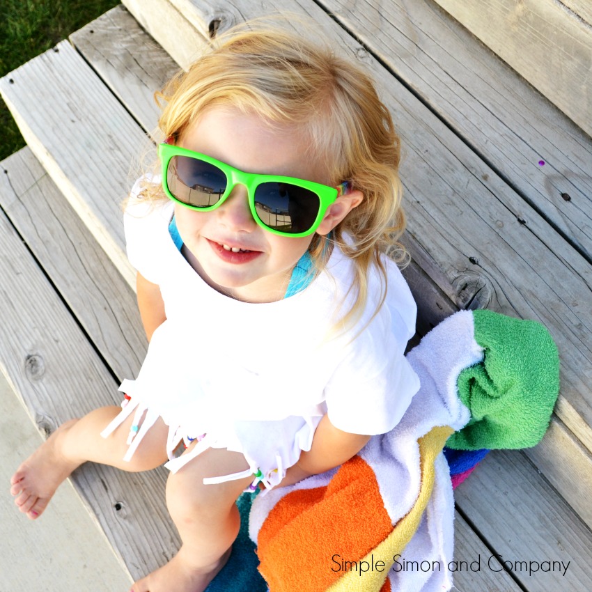 Make this no sew swimsuit cover up from a tee shirt! Just cut and add embellishments, so cute! Easy sewing tutorial, fun summer project idea, cute kids craft to work on!