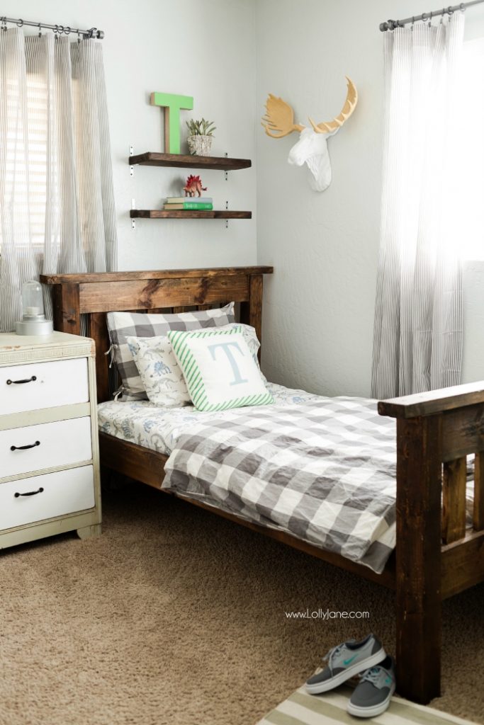 Vintage Industrial Boys Bedroom. Lots of wood tones, grays and neutrals for a vintage industrial boys bedroom. Cute decor ideas and tips to keep it neat. Fun accessories like a basketball hoop and green lockers to complete the space.