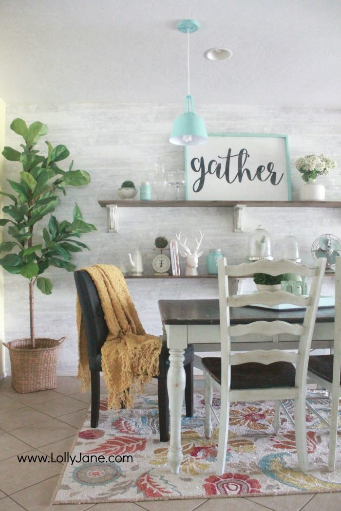 Gorgeous farmhouse dining room. All the tips to achieve this look without breaking the bank! Love the aqua dining room accents and the farmhouse pendants too! Pretty neutral dining room ideas!