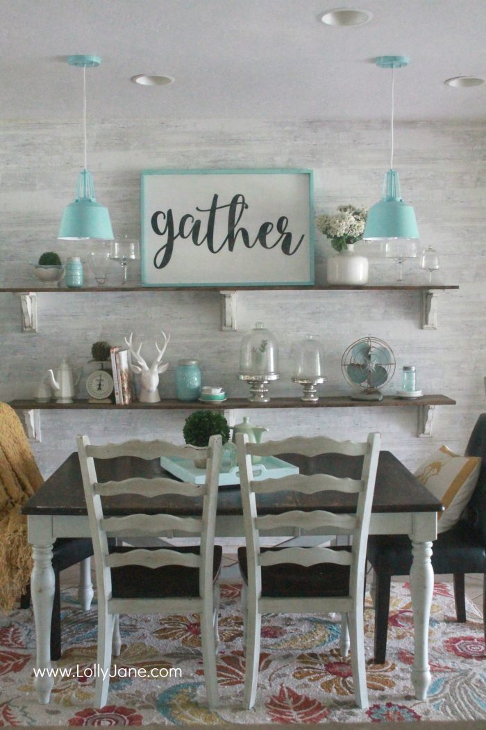 Gorgeous farmhouse dining room. All the tips to achieve this look without breaking the bank! Love the aqua dining room accents and the farmhouse pendants too! Pretty neutral dining room ideas!