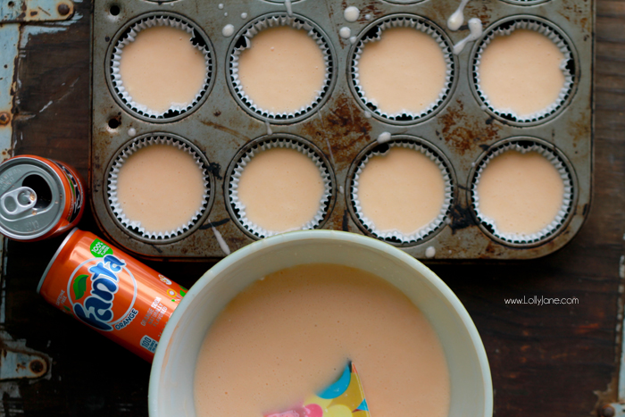 Orange Fanta GHOST Cupcakes, perfect for Halloween! Sprinkled with crushed OREO's to look like dirt. Boo!