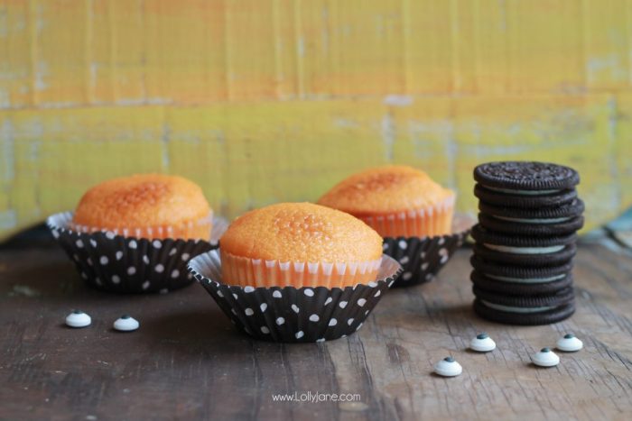 Orange Fanta GHOST Cupcakes, perfect for Halloween! Sprinkled with crushed OREO's to look like dirt. Boo!