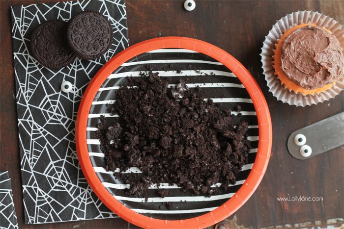 Orange Fanta GHOST Cupcakes, perfect for Halloween! Sprinkled with crushed OREO's to look like dirt. Boo!