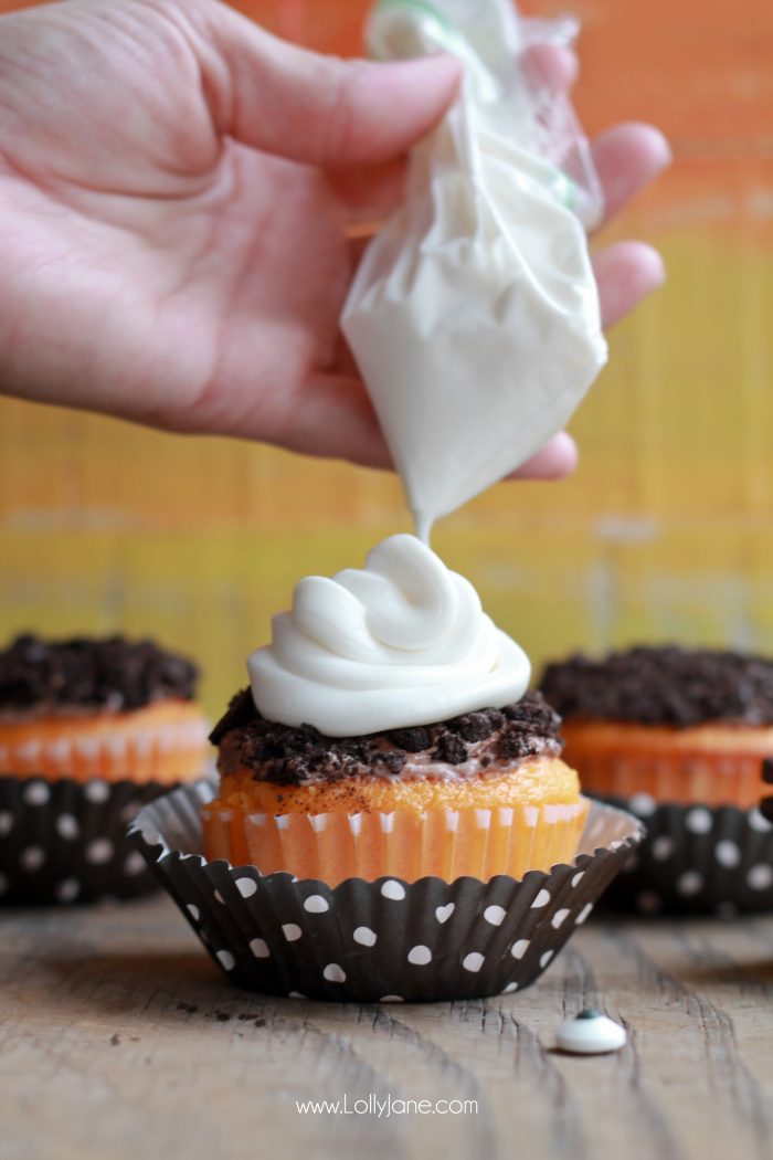 Orange Fanta GHOST Cupcakes, perfect for Halloween! Sprinkled with crushed OREO's to look like dirt. Boo!