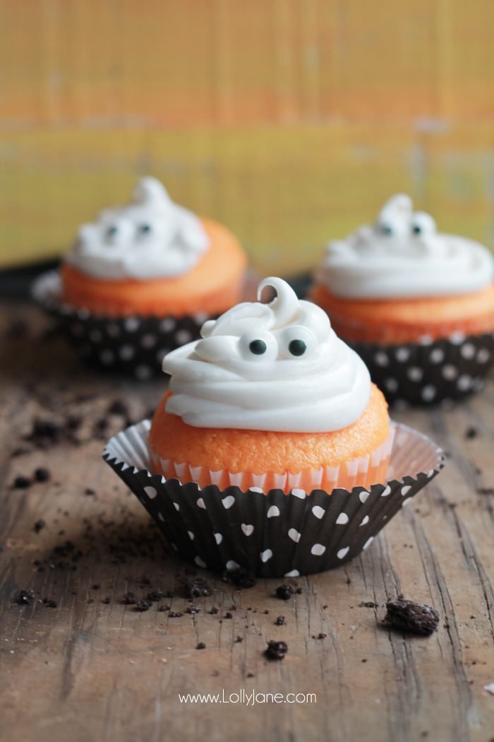 Orange Fanta GHOST Cupcakes, perfect for Halloween! Sprinkled with crushed OREO's to look like dirt. Boo!