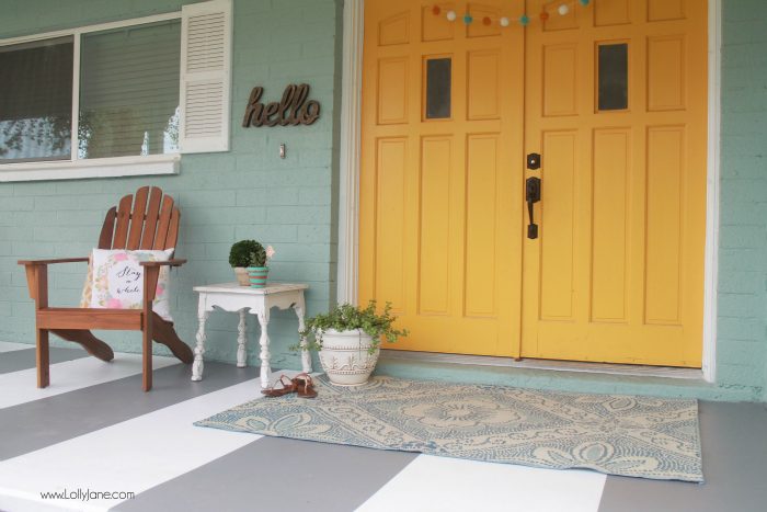 DIY painted striped concrete flooring. Check out this cute gray and white striped porch, easy way to freshen up your porch! Cute front porch decor!