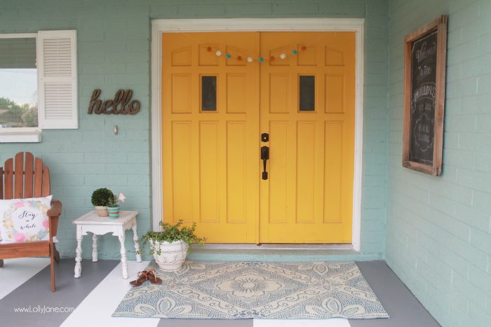 DIY painted striped concrete flooring. Check out this cute gray and white striped porch, easy way to freshen up your porch! Cute front porch decor!