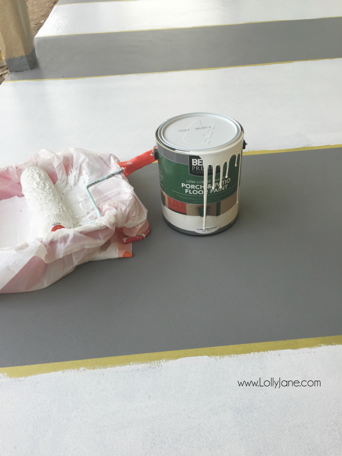How to paint concrete floors: use a concrete paint porch and floor paint for secure adhesion. Click through for an awesome striped porch makeover.