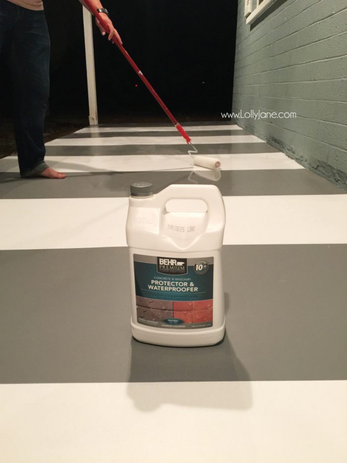 How to seal concrete floors: use a concrete waterproofer for secure adhesion. Click through for an awesome striped porch makeover.