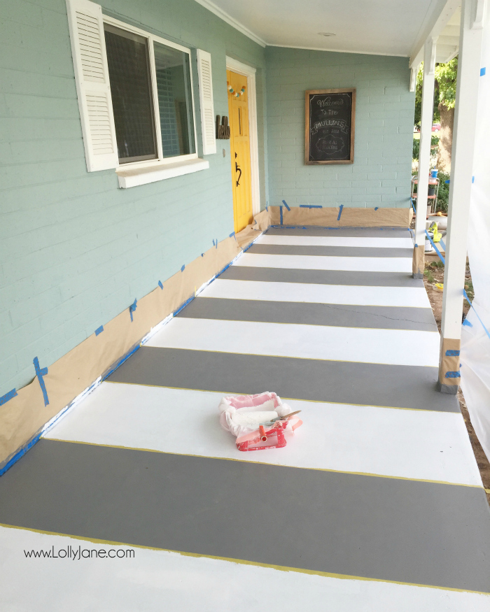 How to paint concrete floors: use a concrete paint porch and floor paint for secure adhesion. Click through for an awesome striped porch makeover.