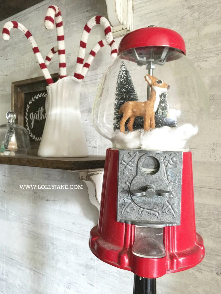 Adorable bottle brush tree gumball machine snow globe! Just stretch cotton balls for snow, set a mini deer + bottle brush trees in a red gumball machine. Cute display via @lollyjaneblog | lollyjane.com