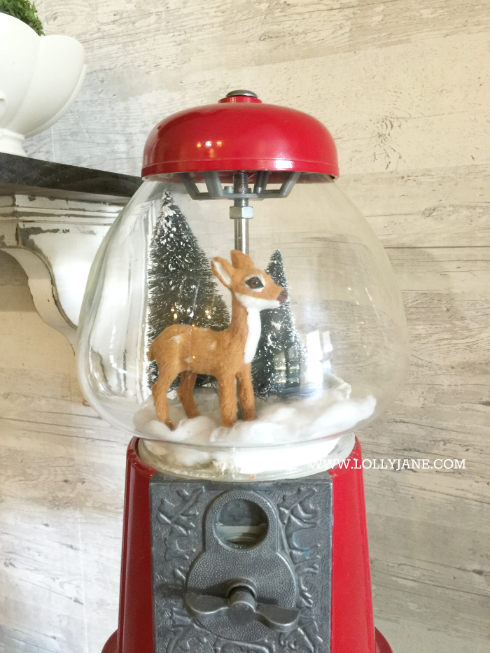 Adorable bottle brush tree gumball machine snow globe! Just stretch cotton balls for snow, set a mini deer + bottle brush trees in a red gumball machine. Cute display via @lollyjaneblog | lollyjane.com