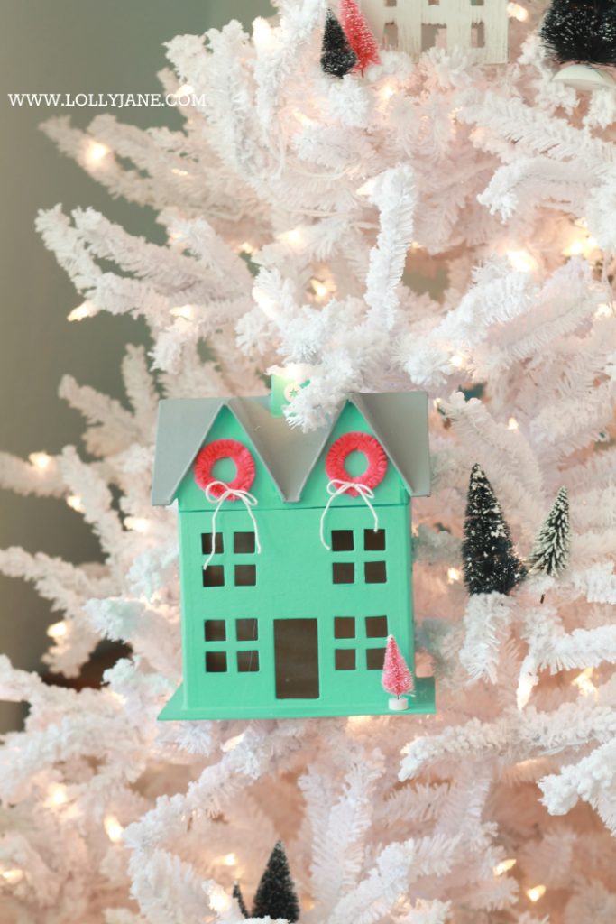 Darling Christmas tree! Love this winter village Christmas tree with Putz houses and bottle brush trees! Fun colorful Christmas tree idea!