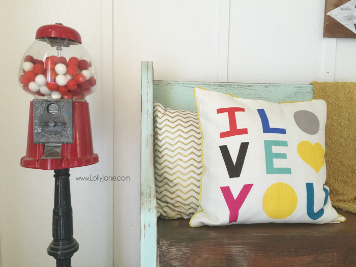 Easy Valentines Day mantel. Layer an empty frame, quick 14 sign for Valentine's Day mantel decor then fill in with random coordinating accessories. Love this easy Valentine's Day mantel!