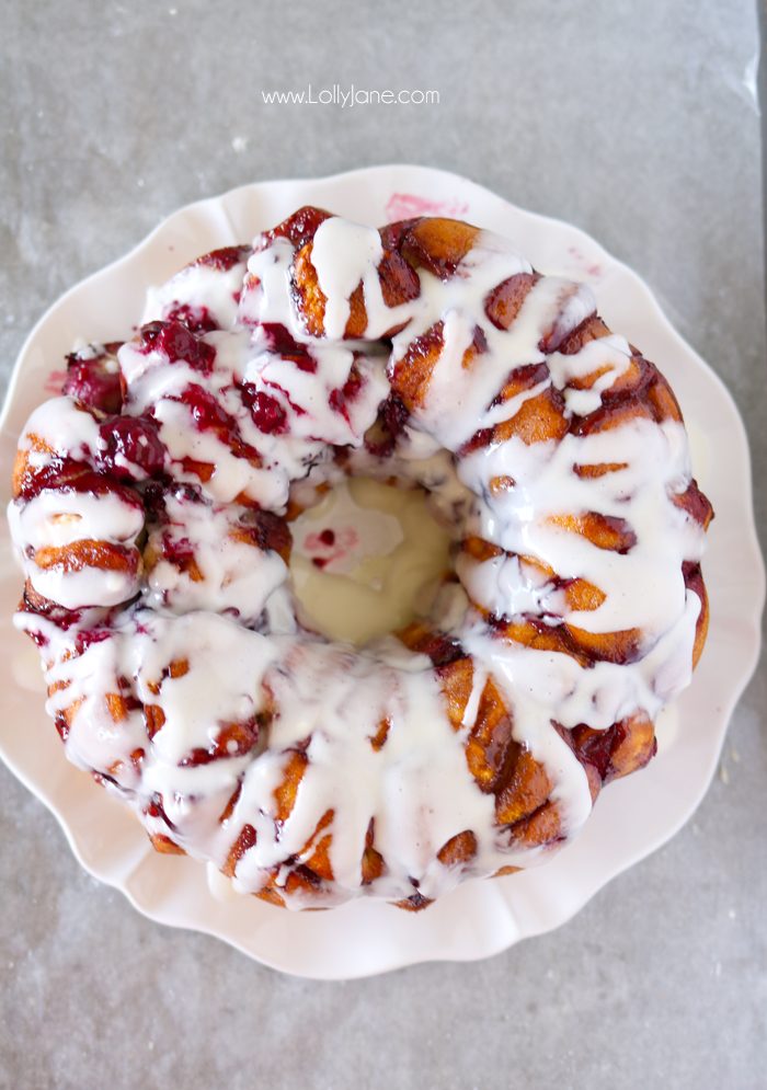 Easy Mixed Berry Monkey Bread filled cream cheese AND a cream cheese glaze. So dang good!