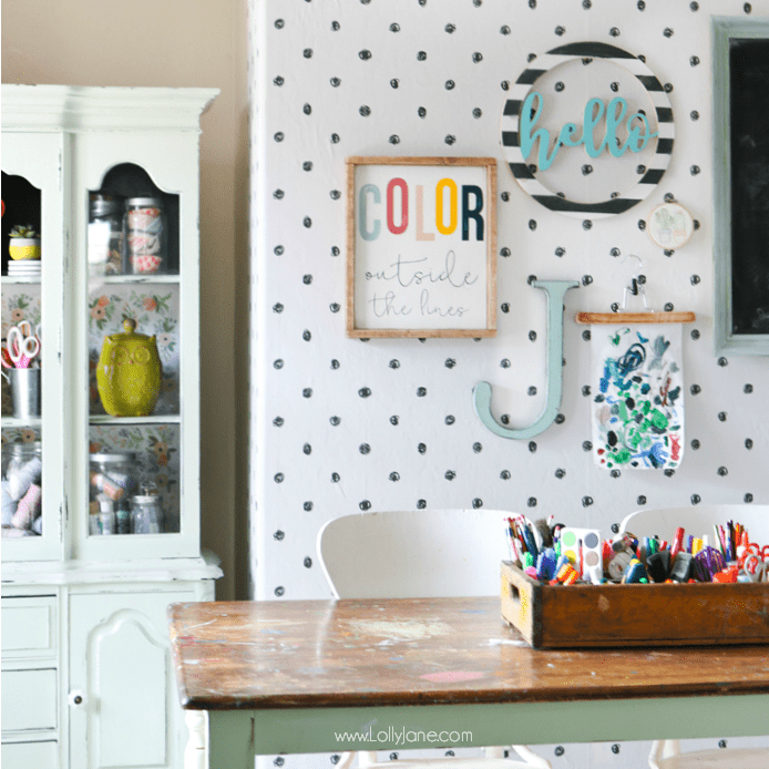 Easy to implement craft room makeover ideas using peel and stick wallpaper. Check out this cute craft room with polka dot peel stick wallpaper, so fun! #craftroom #makeover #roommakeover #peelstickwallpaper #peelandstickwallpaper