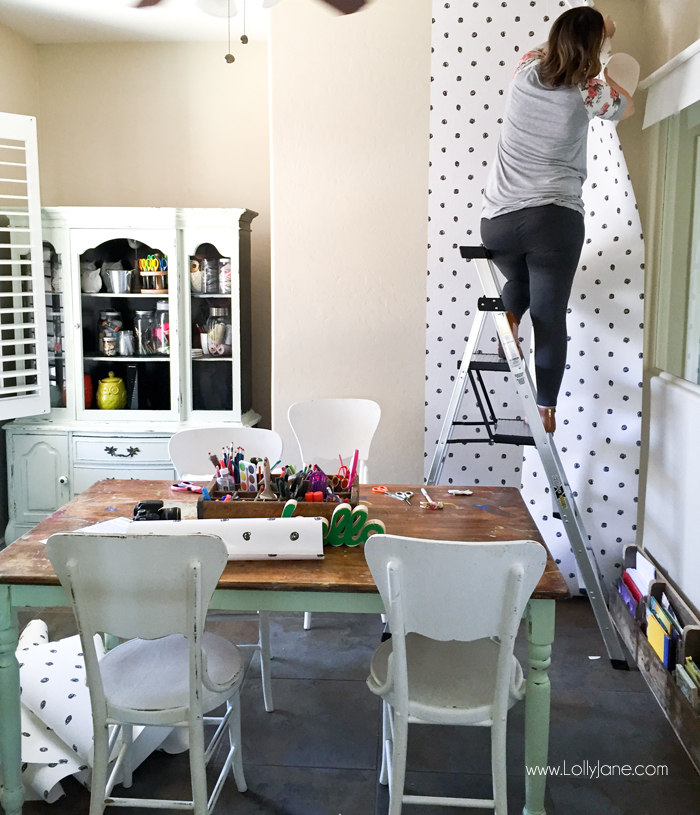 How to apply peel and stick wallpaper for this cute craft room makeover! Love this craft room update using easy to apply wallpaper in a fun polka dot pattern. #peelstick #wallpaper #peelstickwallpaper #polkadotwallpaper #craftroom #craftroommakeover